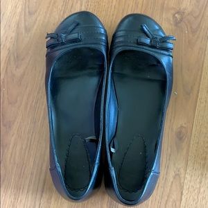 Black flats with a small heel and bows